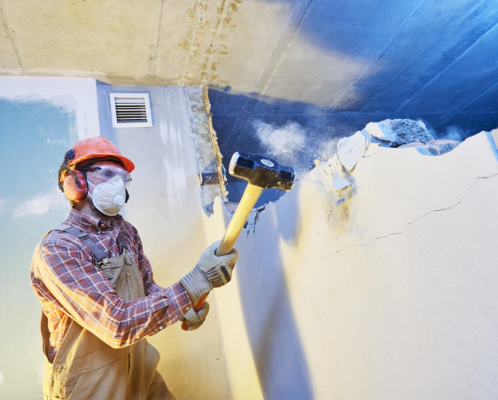 man demolition of wall using sledge hammer bangor pa