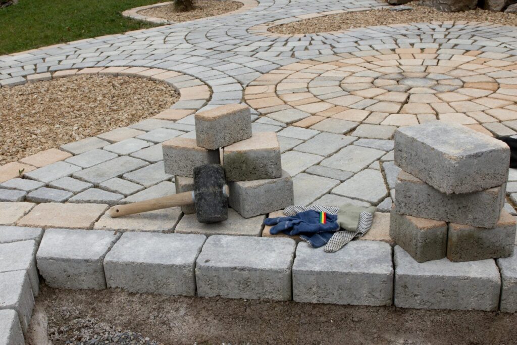 hardscaping laying stone paver walkway